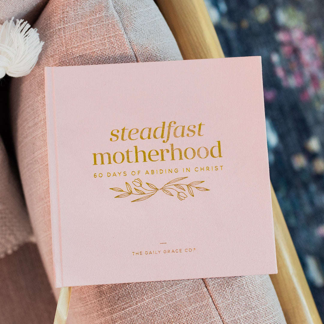 Motherhood devotional book on chair